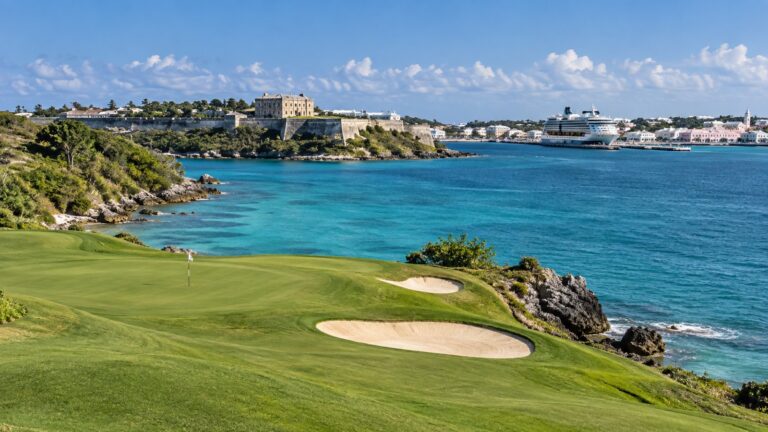 Bermuda oceanside golf course beside turquoise water.