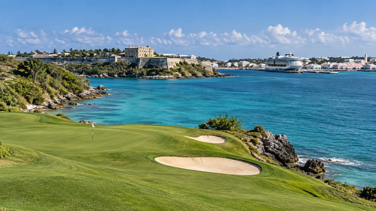 Bermuda oceanside golf course beside turquoise water.