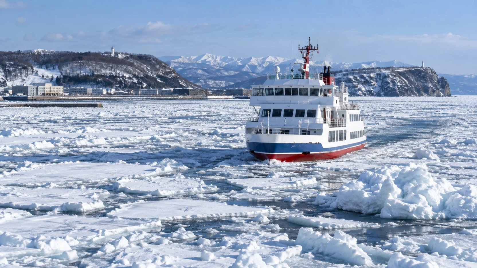 Sightseeing boat crossing drift ice off Abashiri in the Sea of Okhotsk