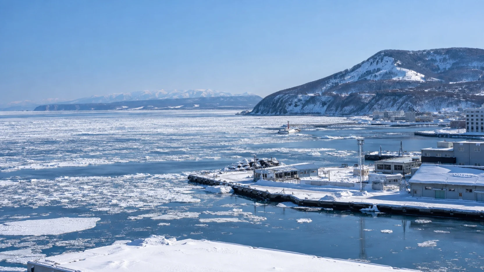 Snowy Abashiri harbor beside drift ice on the Sea of Okhotsk