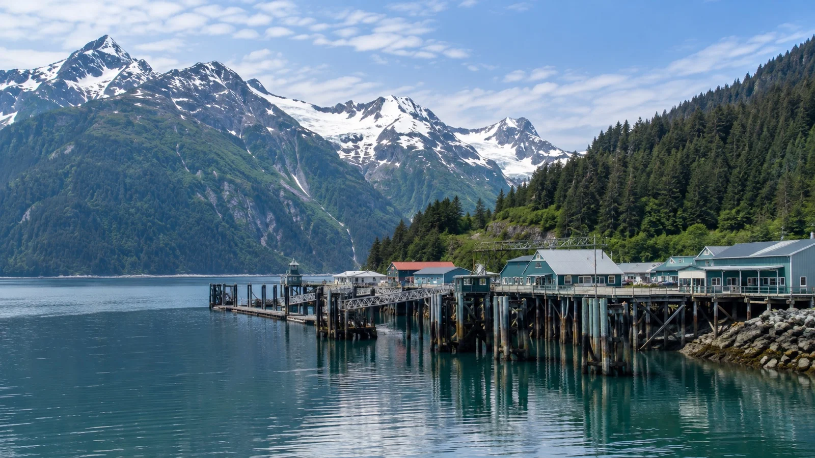 Small Alaska cruise port surrounded by mountains and ocean with no road connection