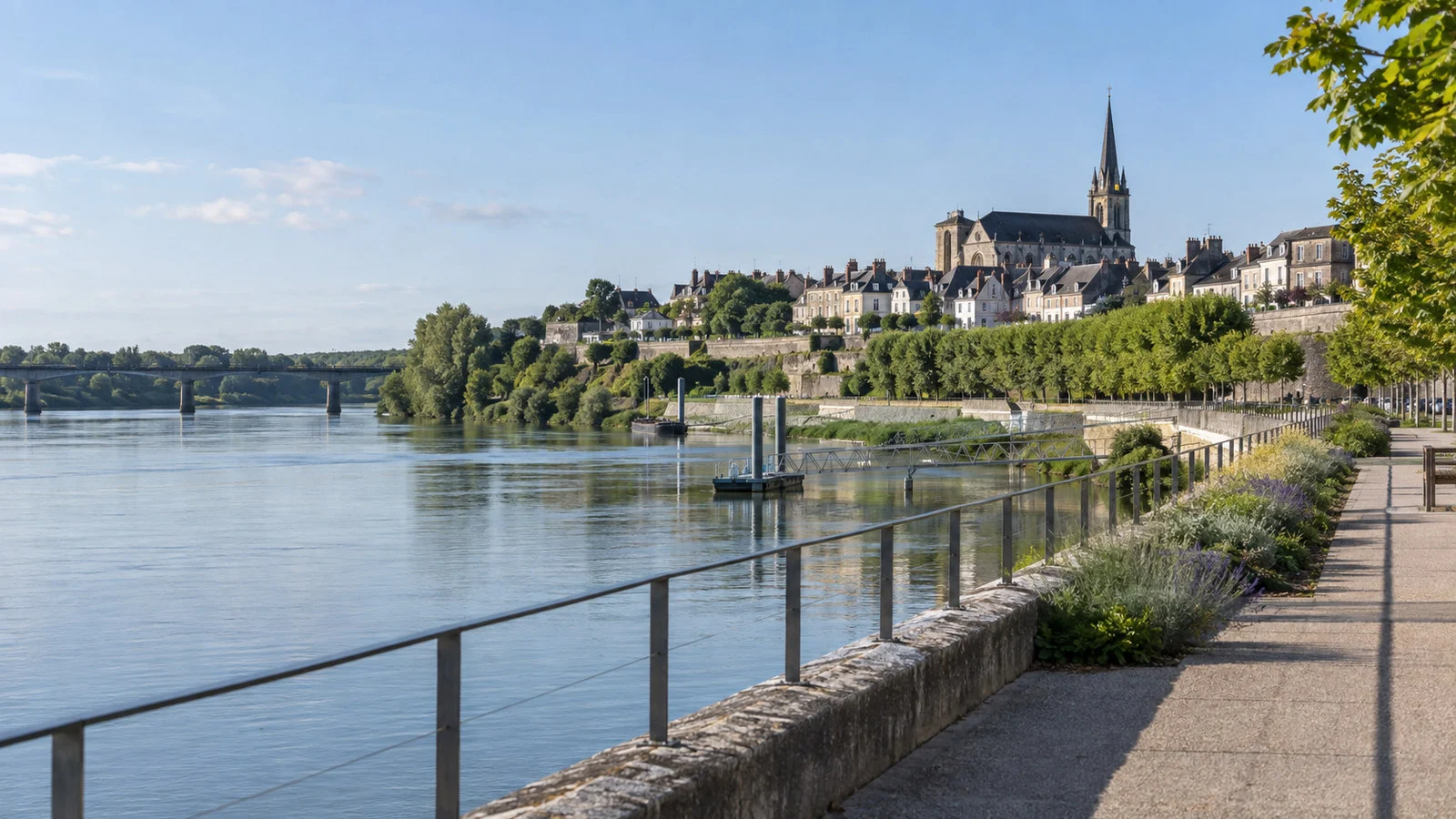 Loire riverside promenade at Ancenis with town rooftops and trees
