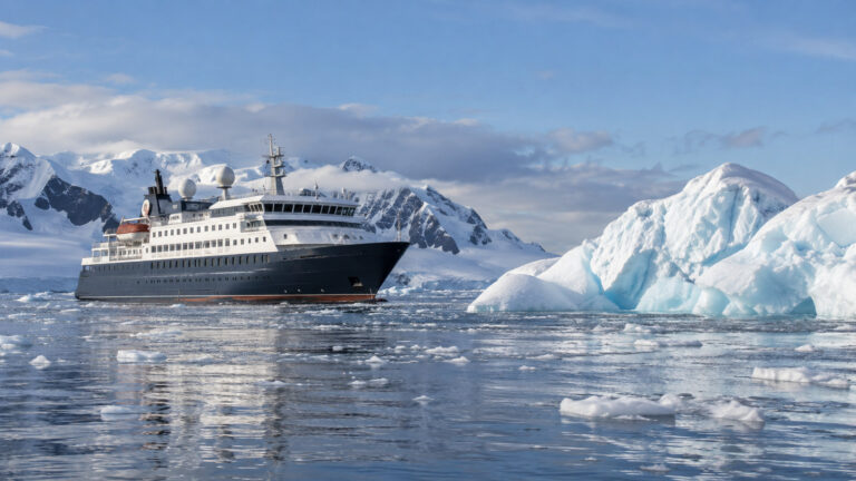 Antarctic Peninsula expedition ship beside ice