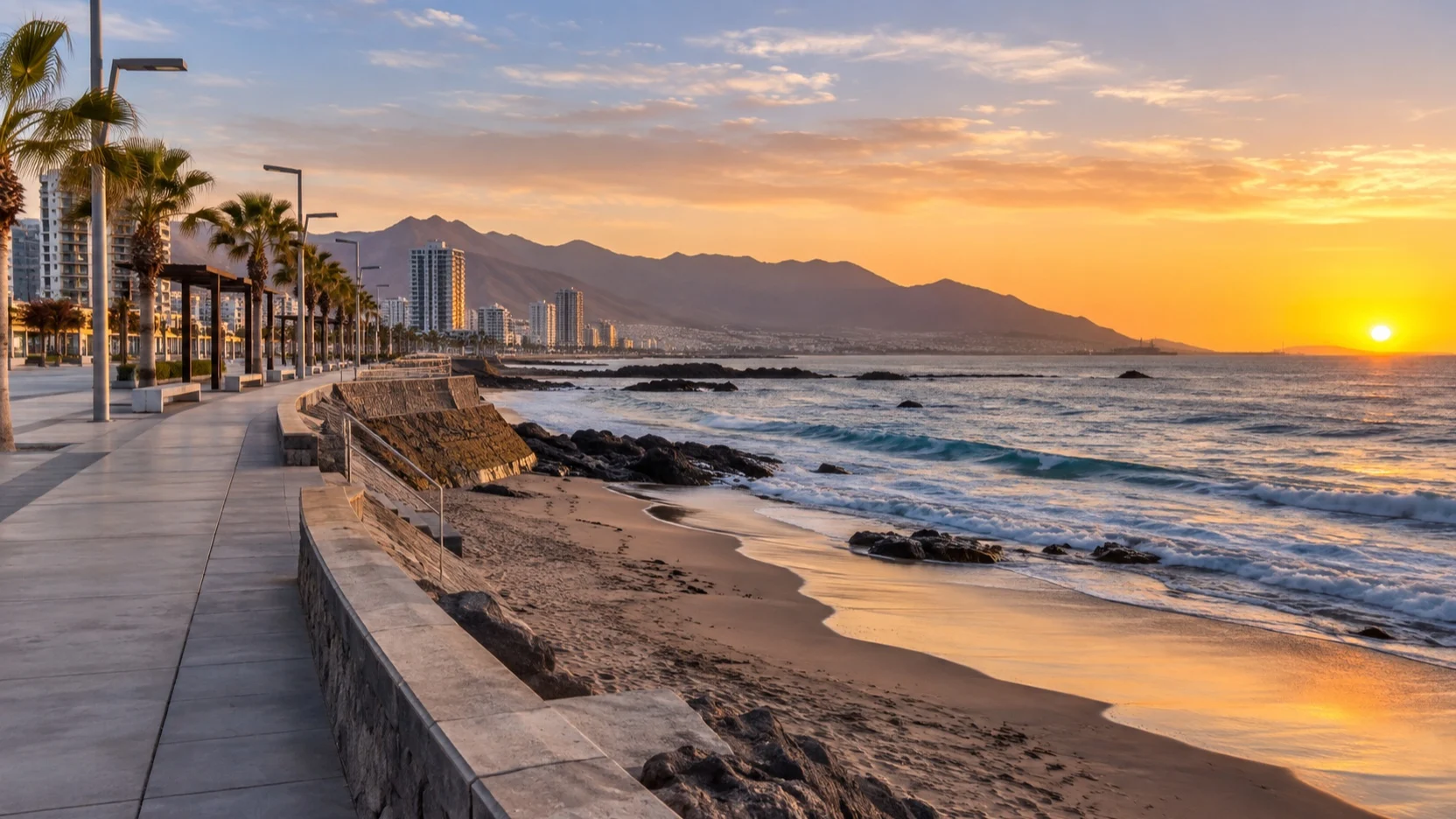 An empty coastal walkway beside Balneario Municipal beach in Antofagasta