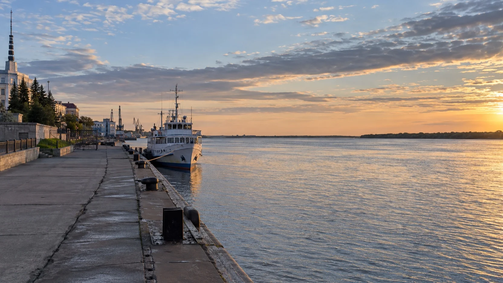 Small river ship at an empty Northern Dvina quay in Arkhangelsk