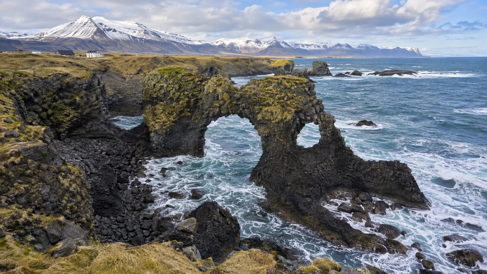 Sea cliffs and stone arch at Arnarstapi on the Snæfellsnes Peninsula