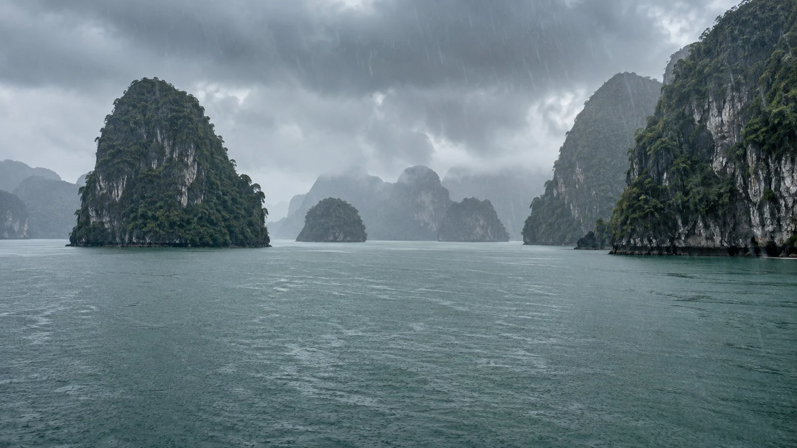 Rainy Ha Long Bay Vietnam with limestone islands