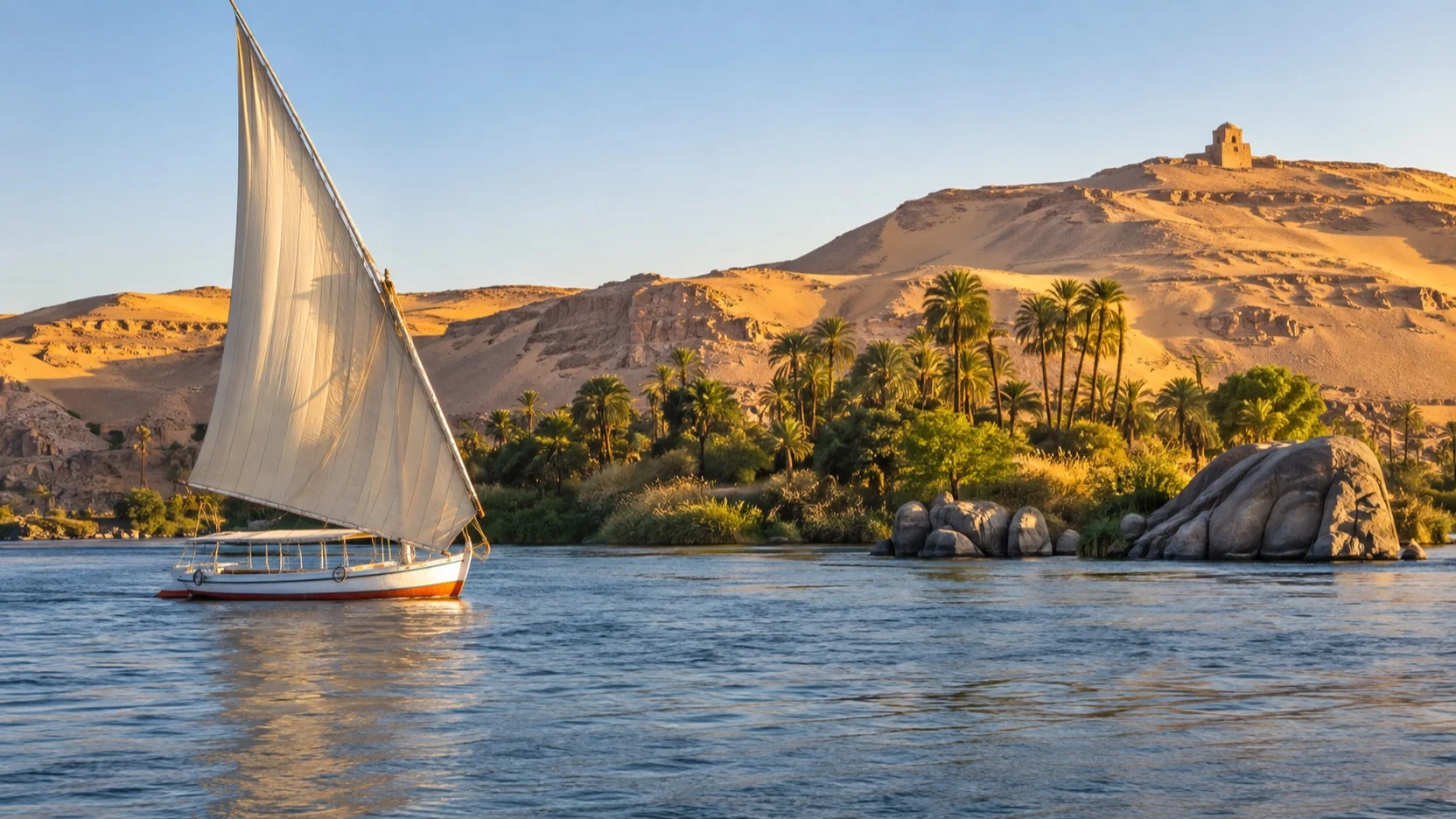 Traditional felucca sailing on the Nile near Aswan
