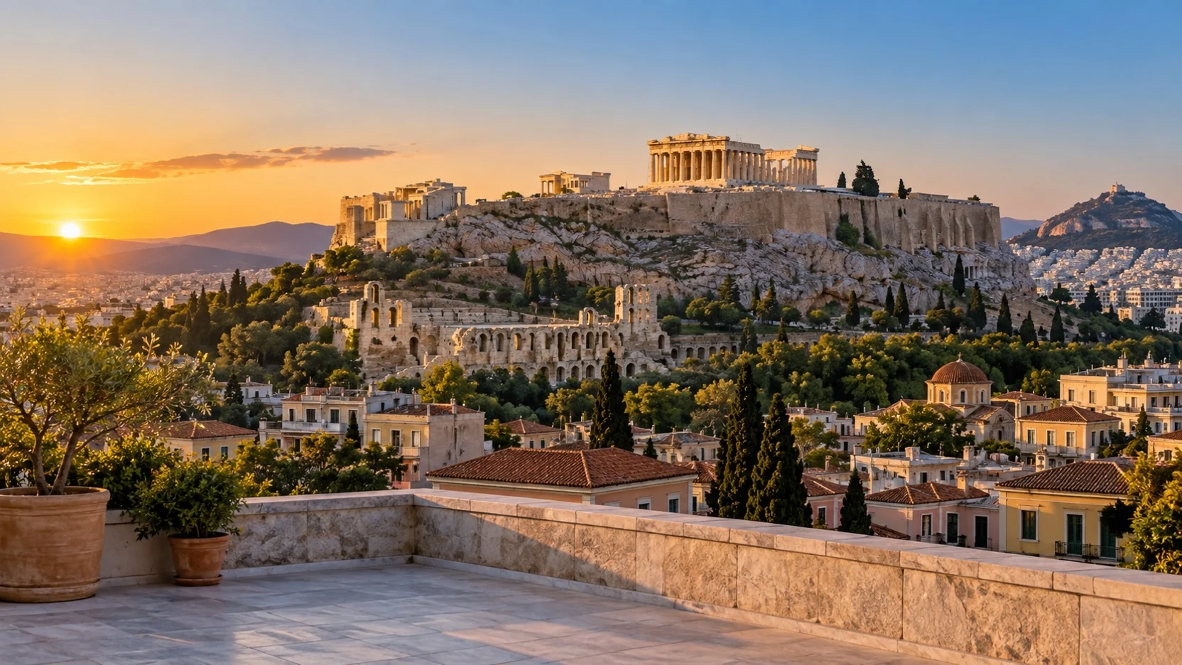 Athens Acropolis and Parthenon above city rooftops at sunset