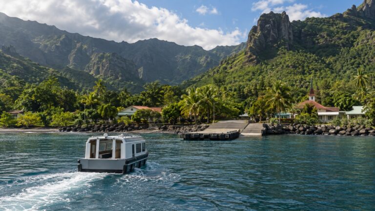 Tender boat approaching a landing in Atuona bay