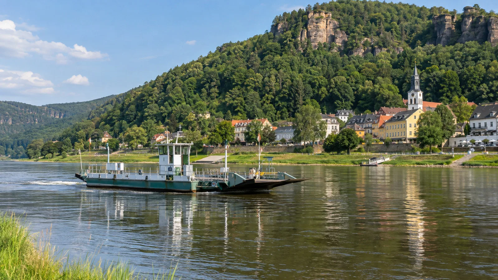 Elbe ferry crossing near Bad Schandau beneath wooded hills
