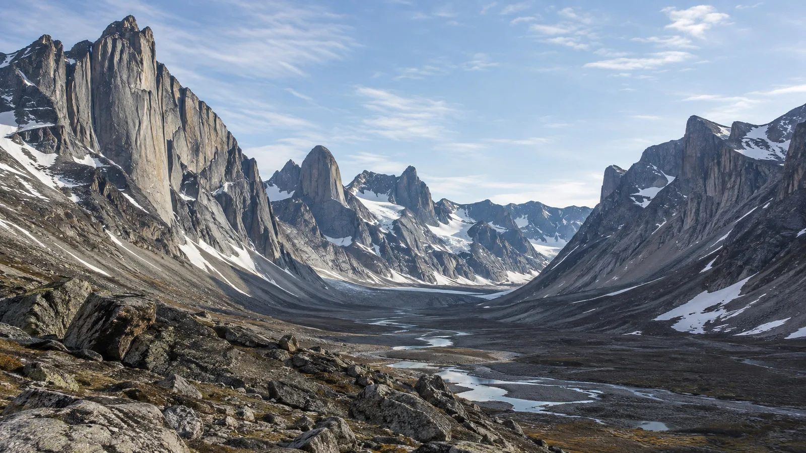 Auyuittuq National Park Baffin Island granite peaks and deep Arctic valley with snow patches