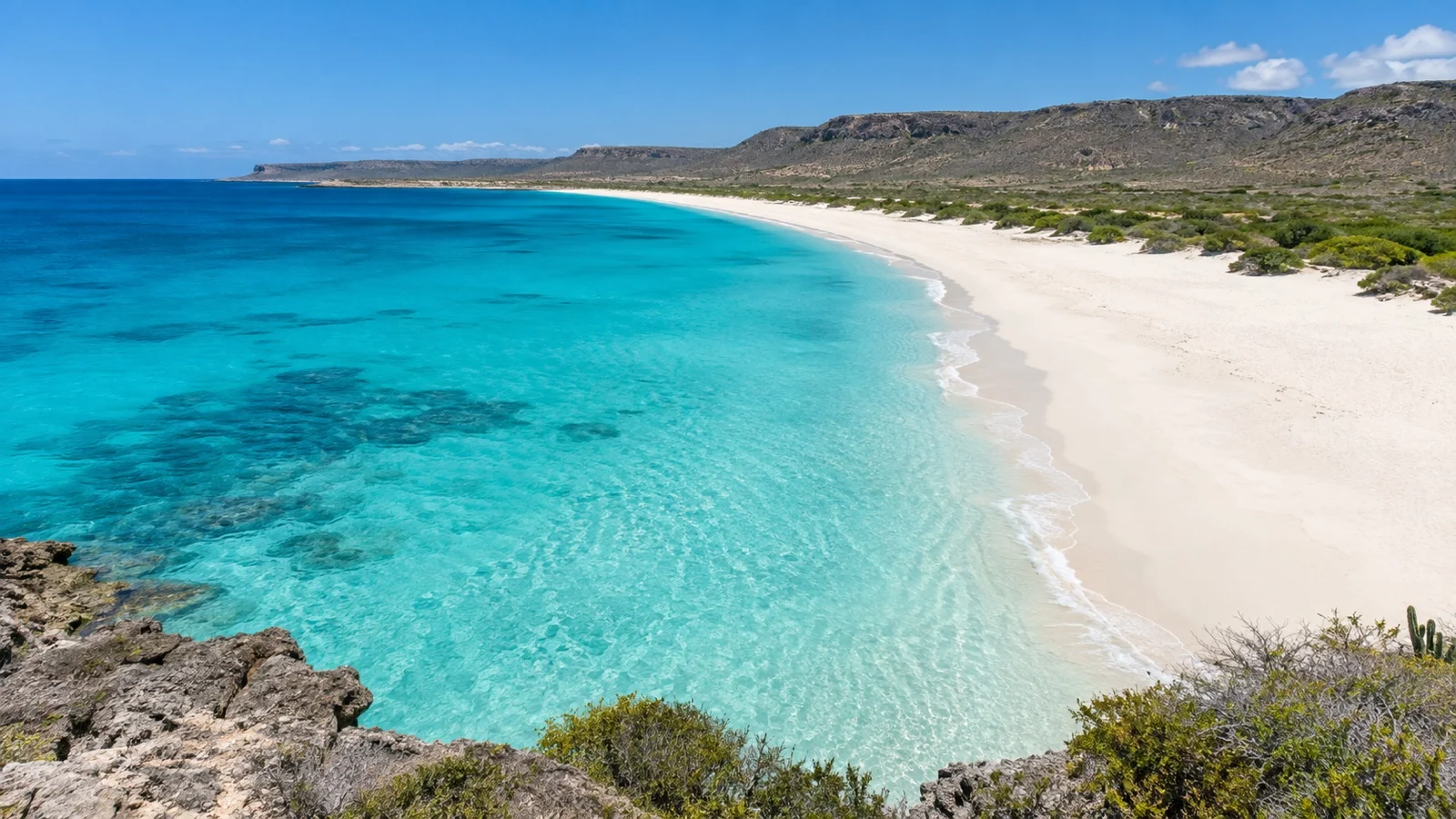 Empty white sand beach and turquoise water at Bahía de las Águilas