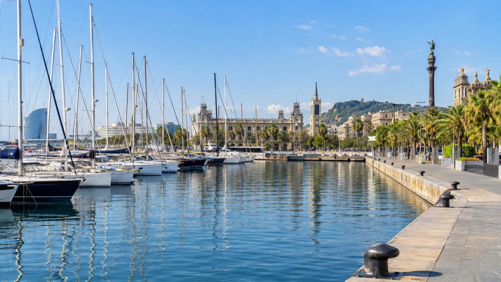 Port Vell marina and Barcelona waterfront on a clear day