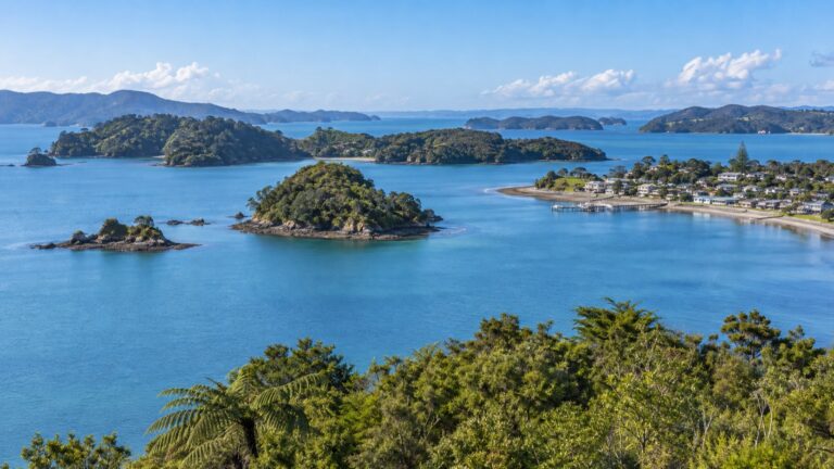 Green islands and calm tender bay near Paihia, New Zealand
