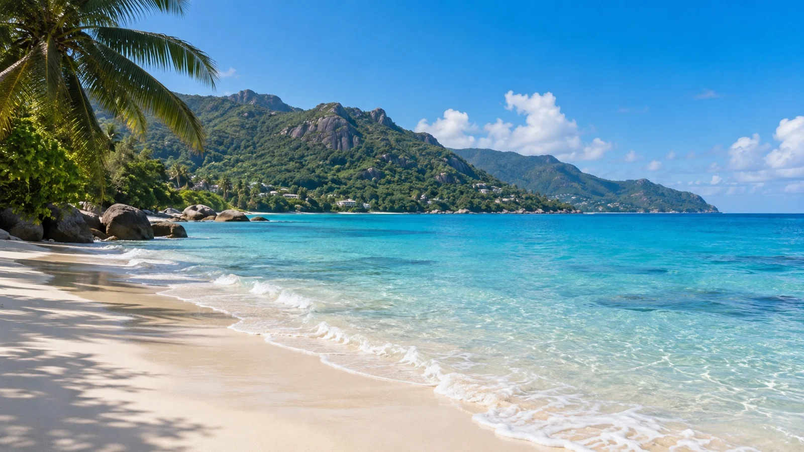 Empty Beau Vallon beach on Mahé, Seychelles, with turquoise water and granite hills