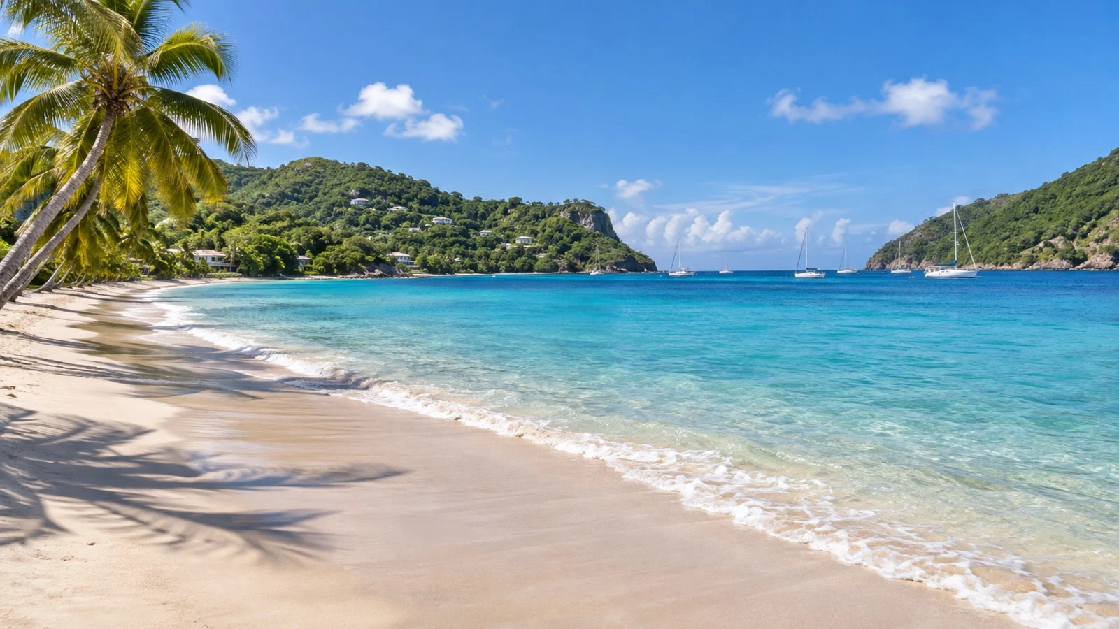 Empty Lower Bay beach framed by green hills on Bequia