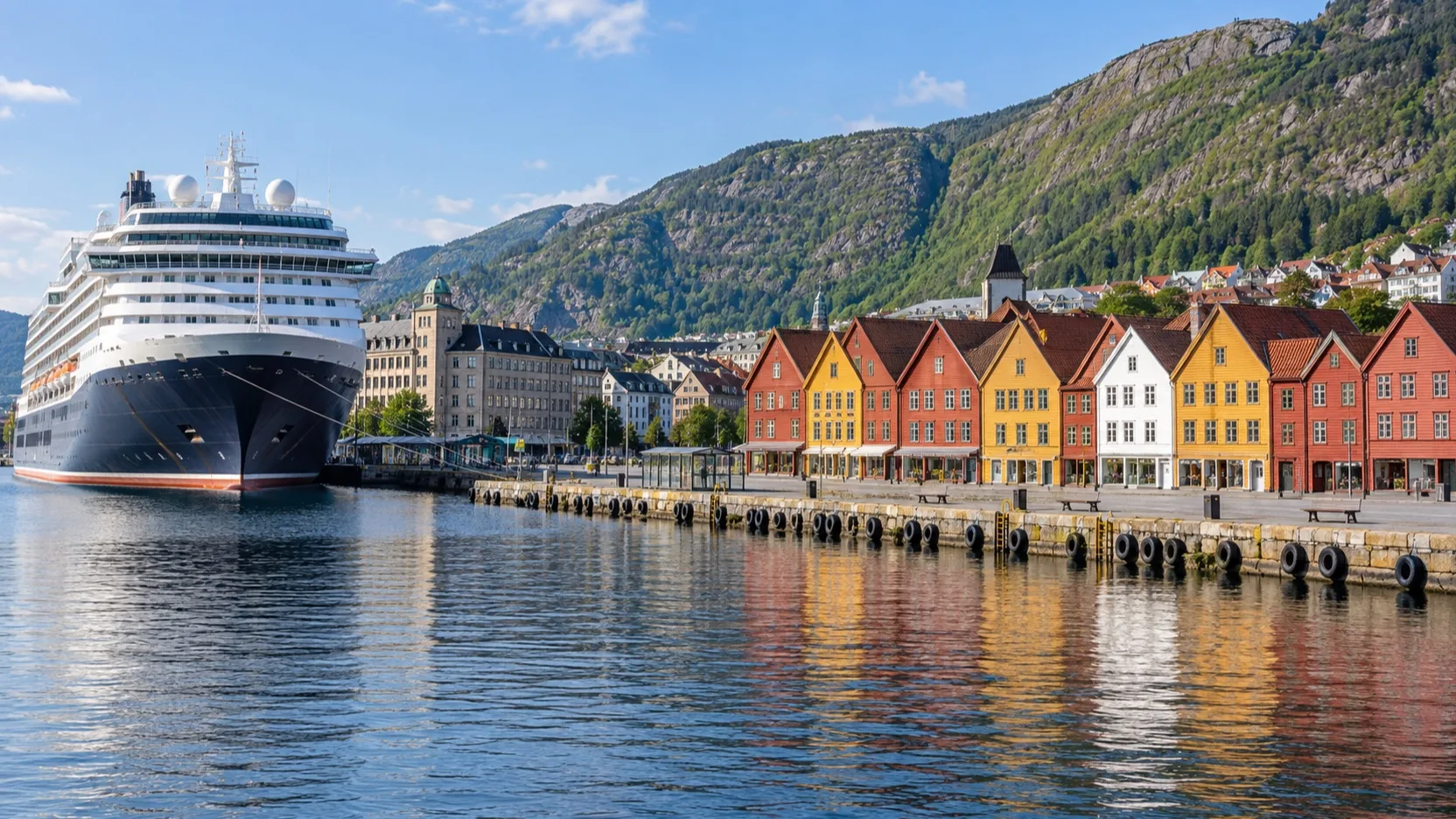 Cruise ship beside Bergen's colorful Bryggen harbor buildings