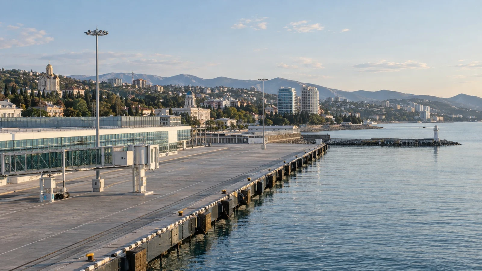 Quiet Black Sea cruise terminal with empty berth and city beyond