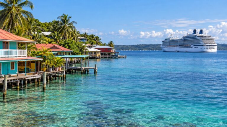 Cruise ship offshore from colorful Isla Colón waterfront in Bocas del Toro