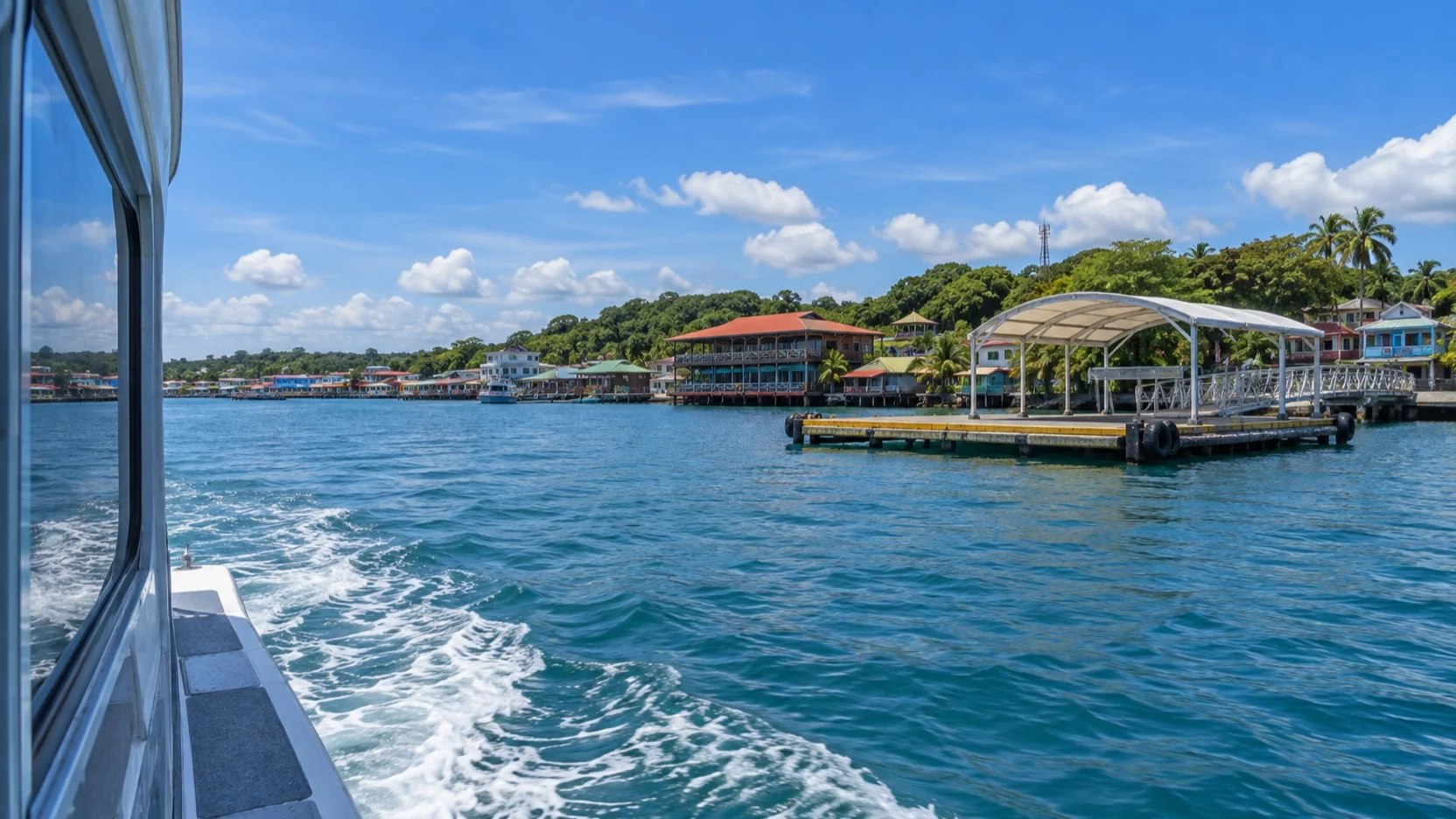Tender approaching Bocas Town across turquoise water