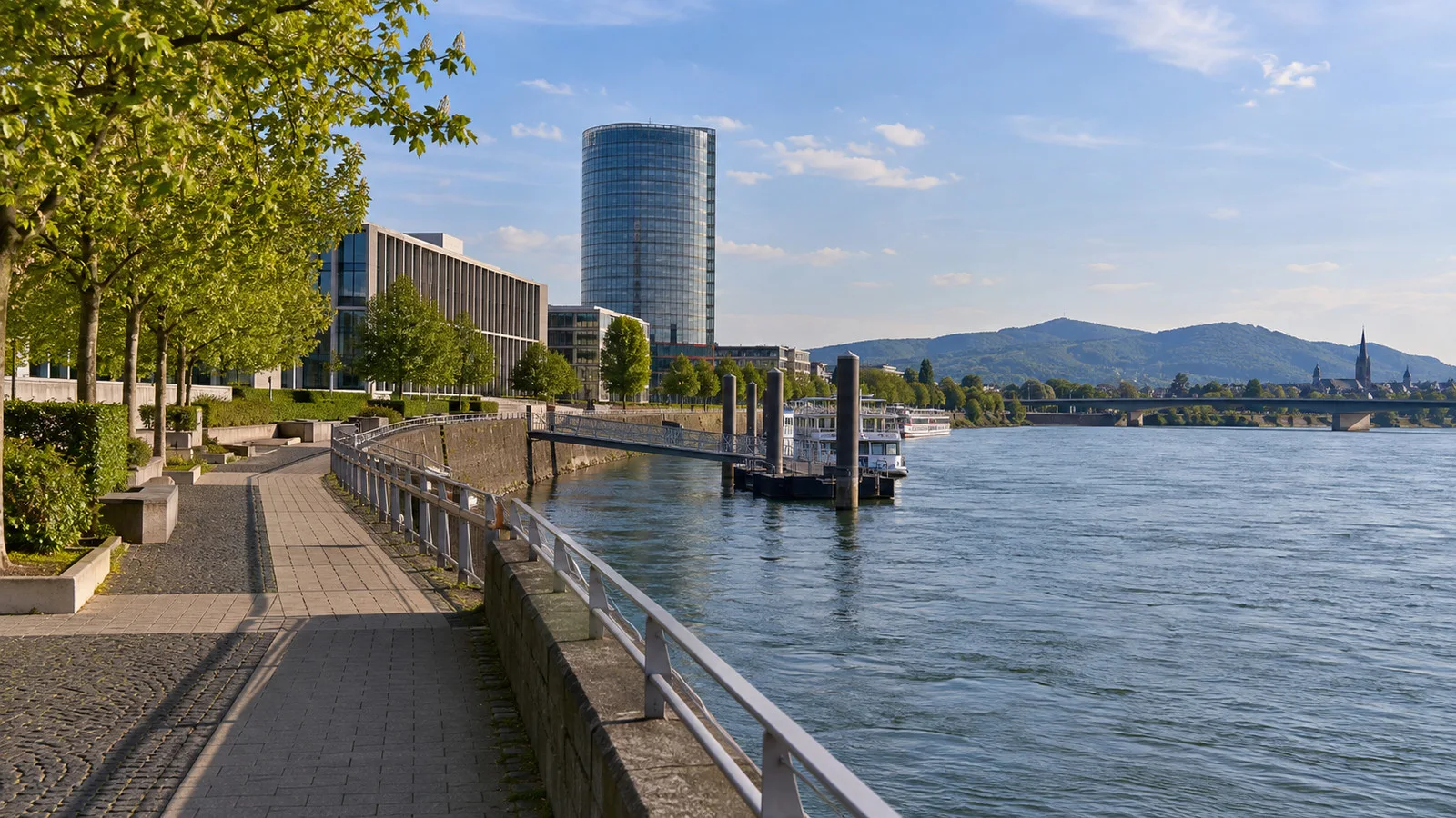 Bonn's former government district near the Rhine with modern civic buildings and a quiet promenade