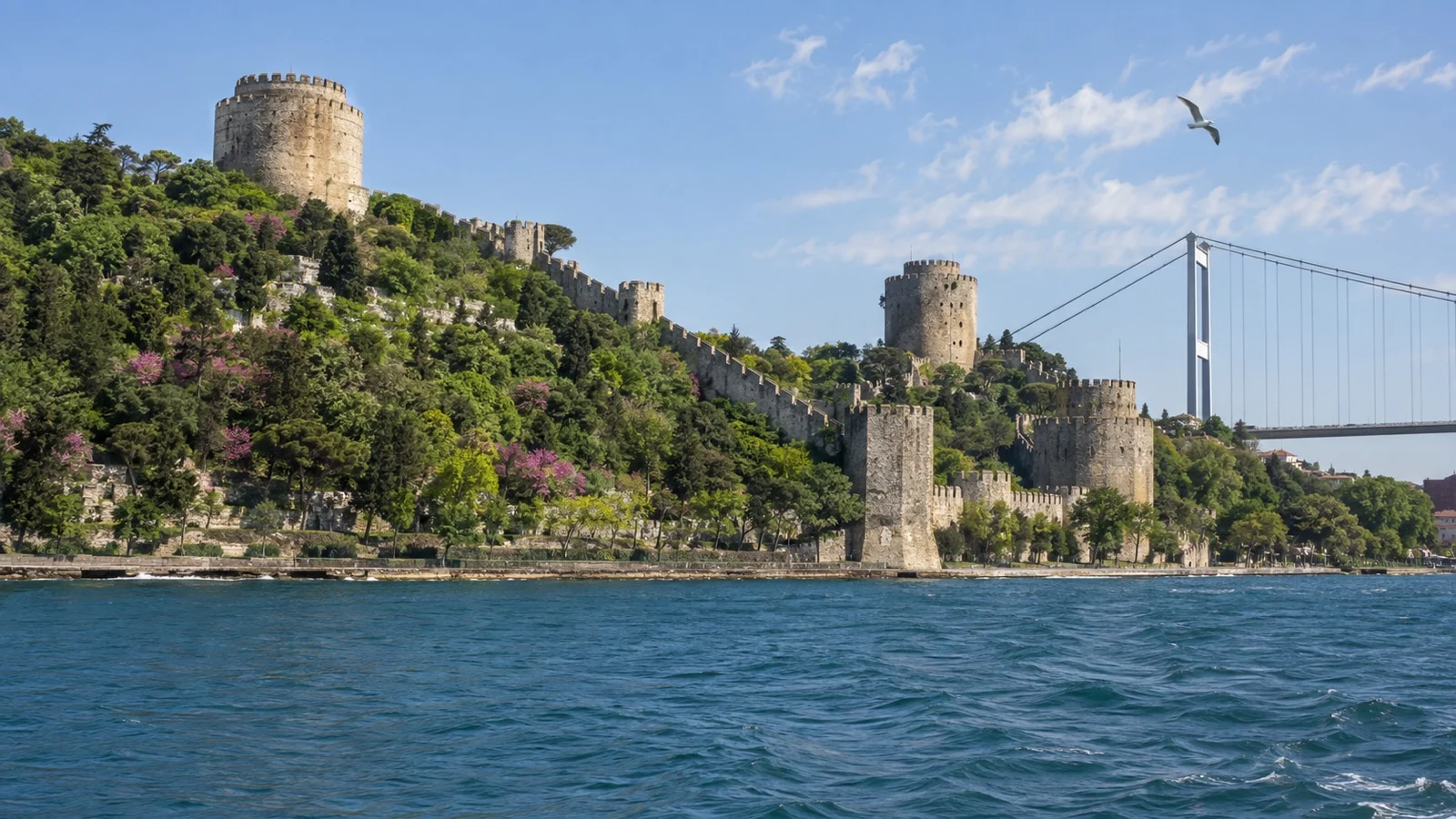 Historic Rumeli Fortress on Bosphorus shore seen from a passing ship