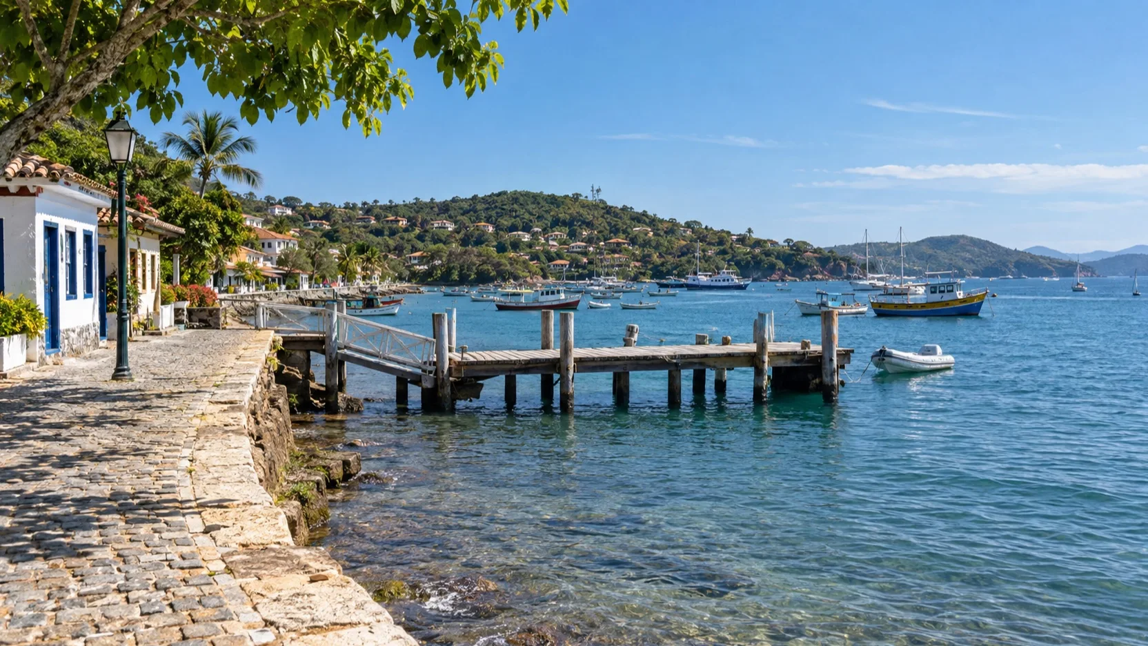 Búzios tender pier and waterfront beside its blue bay