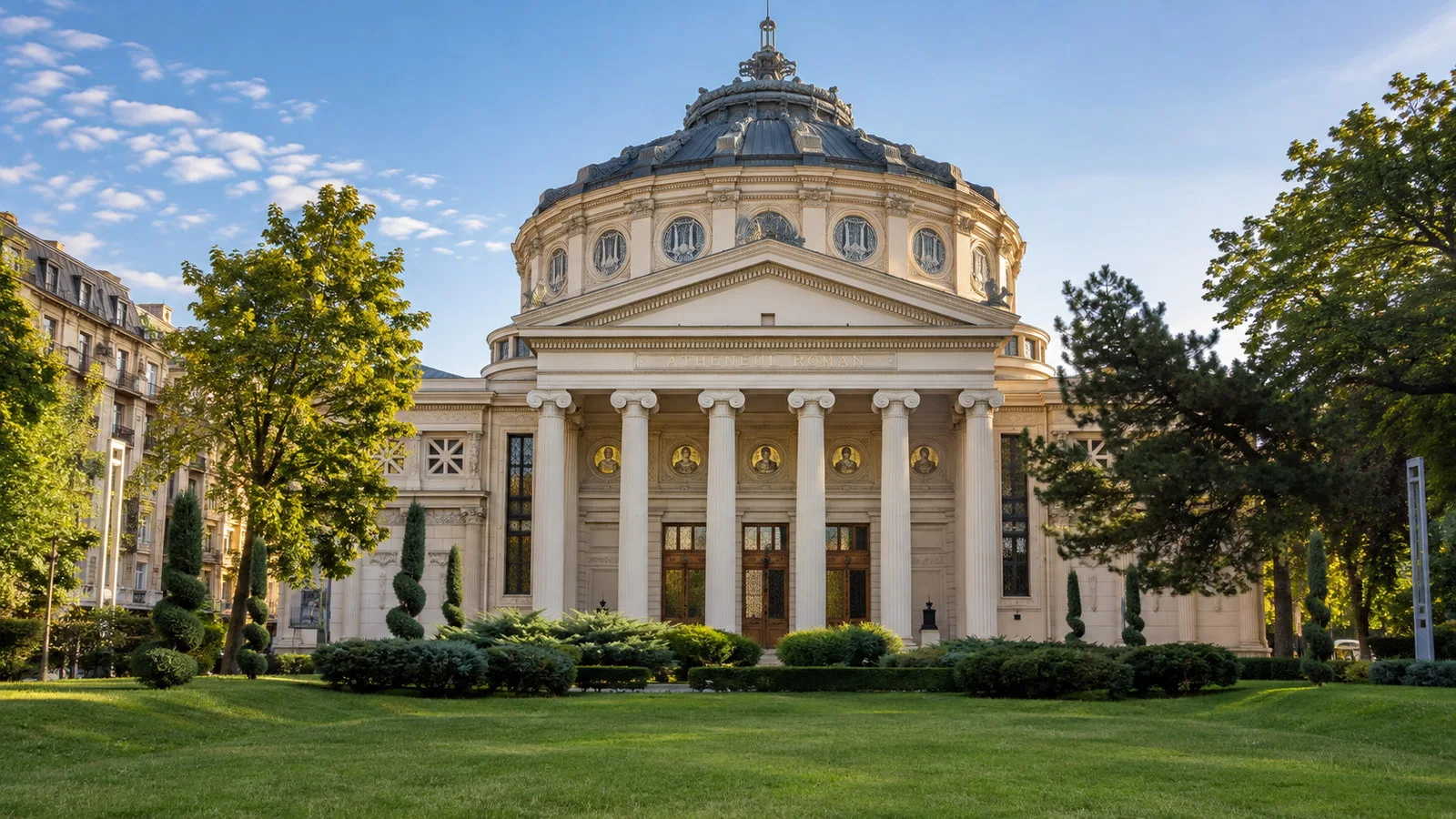 Romanian Athenaeum Bucharest circular domed concert hall facade with columns and garden, no people