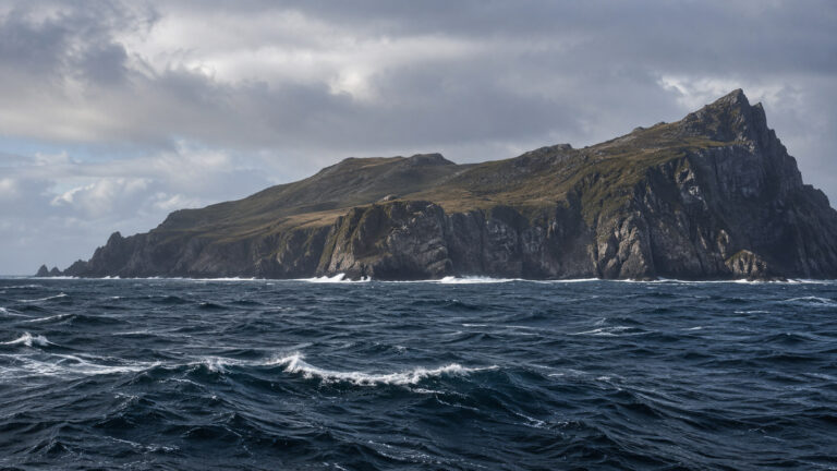Cape Horn Chile dramatic windswept island headland seen from expedition cruise ship at sea with dark Southern Ocean, no people
