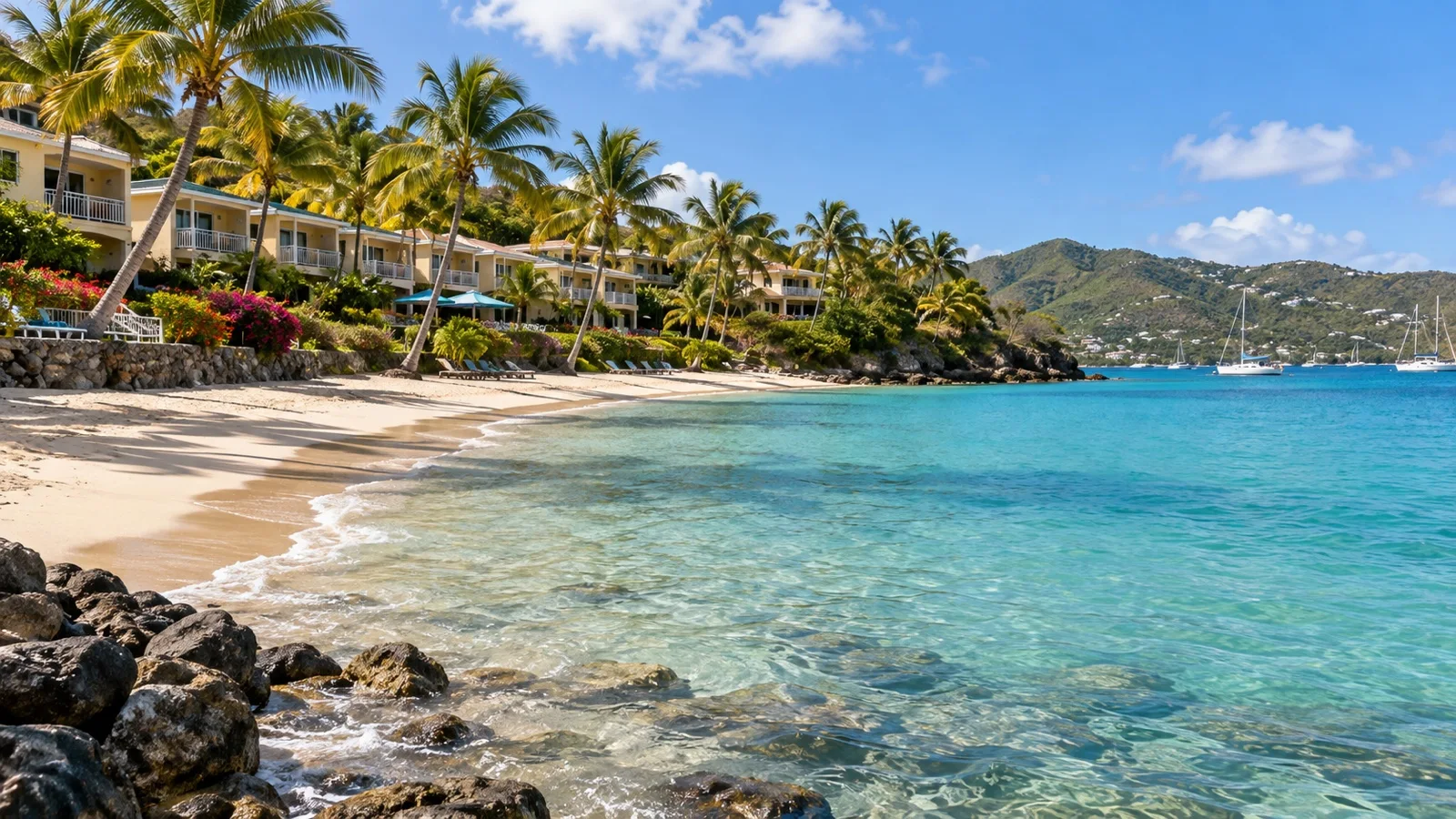 Bolongo Bay on St. Thomas with midrange beachfront resort buildings, palms and calm water