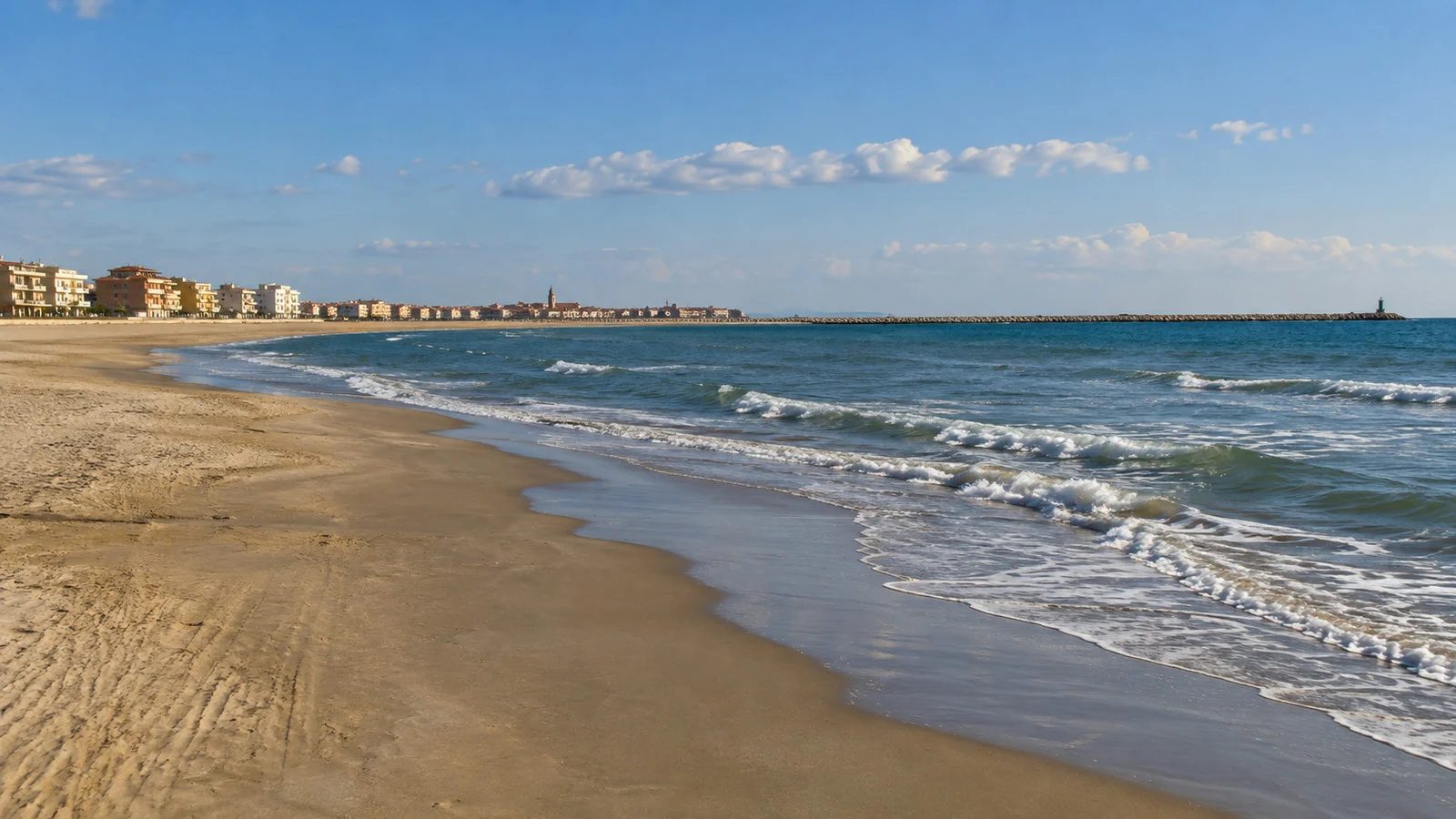 Sottomarina's broad sandy beach and Adriatic water near Chioggia with no beachgoers