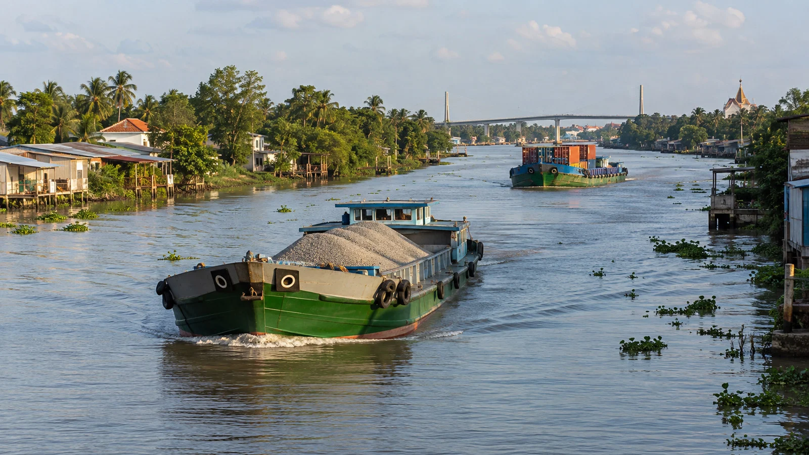 Cargo boats passing through Chợ Gạo canal