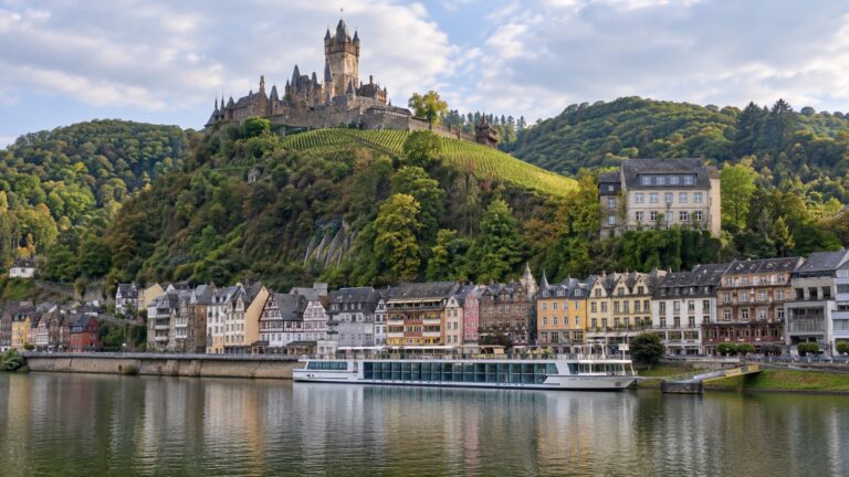 River cruise ship at Cochem beneath Reichsburg Castle on the Moselle