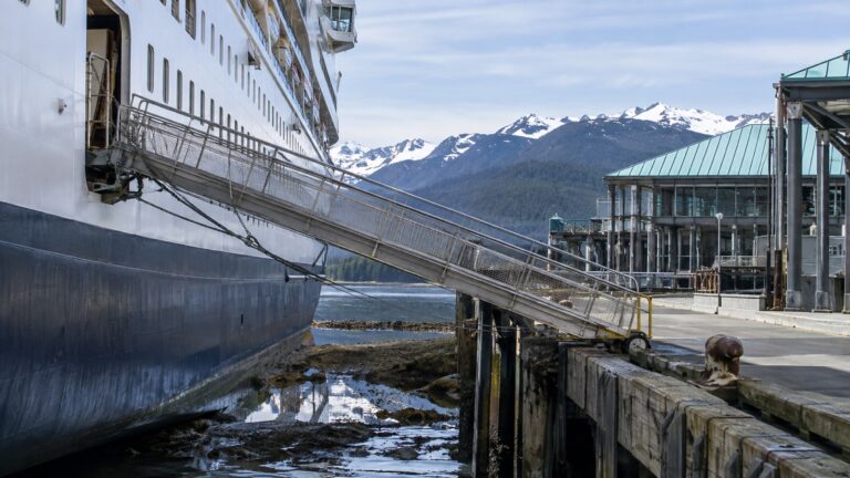 Empty steep cruise ship gangway between vessel and pier at low tide