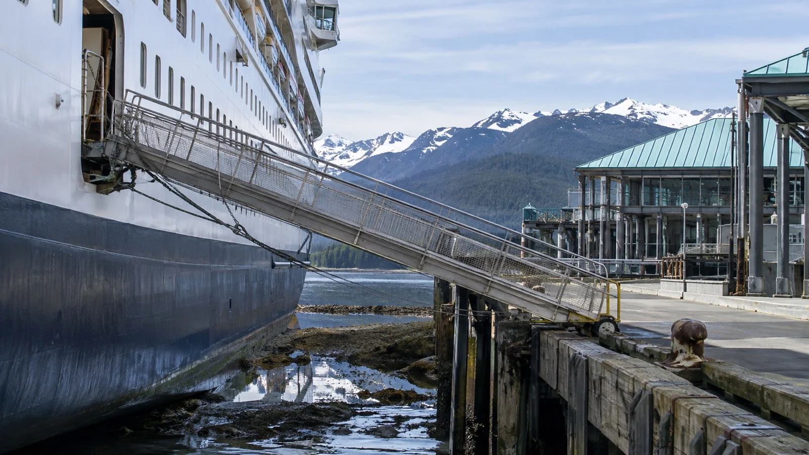 Empty steep cruise ship gangway between vessel and pier at low tide