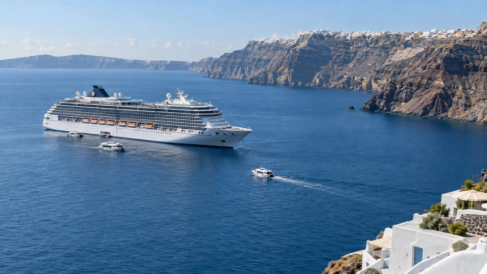 a cruise ship at anchor off Santorini's caldera with tender boats on blue water, no people visible