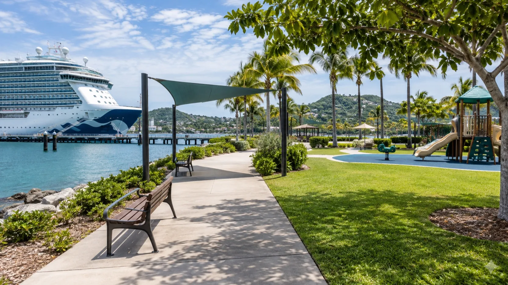Shaded waterfront path and empty playground near a cruise ship