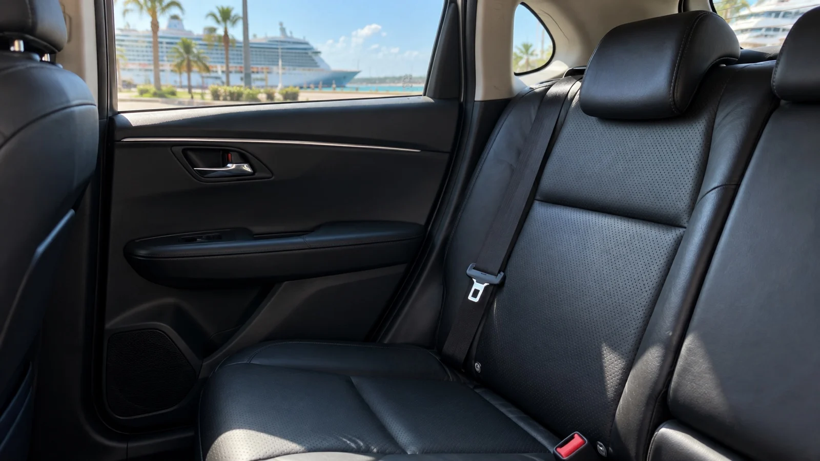 Close view of empty taxi back seat with visible seat belt and buckle