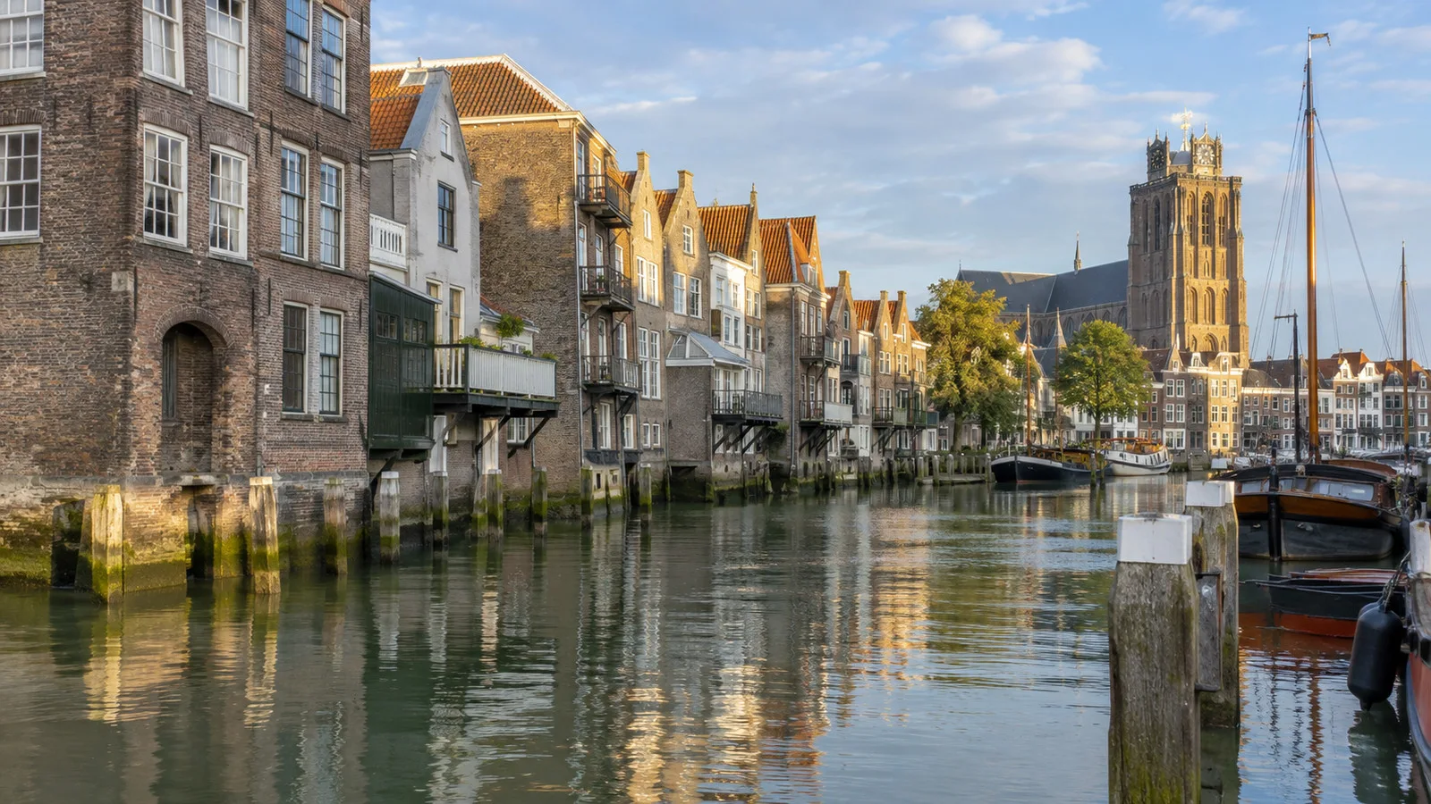 Old harbor buildings along a Dordrecht canal