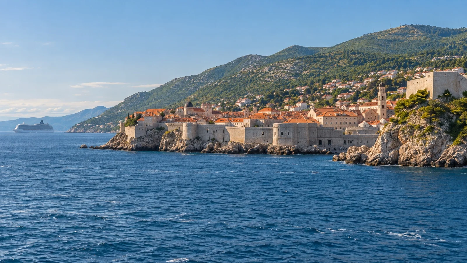 Dubrovnik old town by the Adriatic with a cruise ship offshore in May