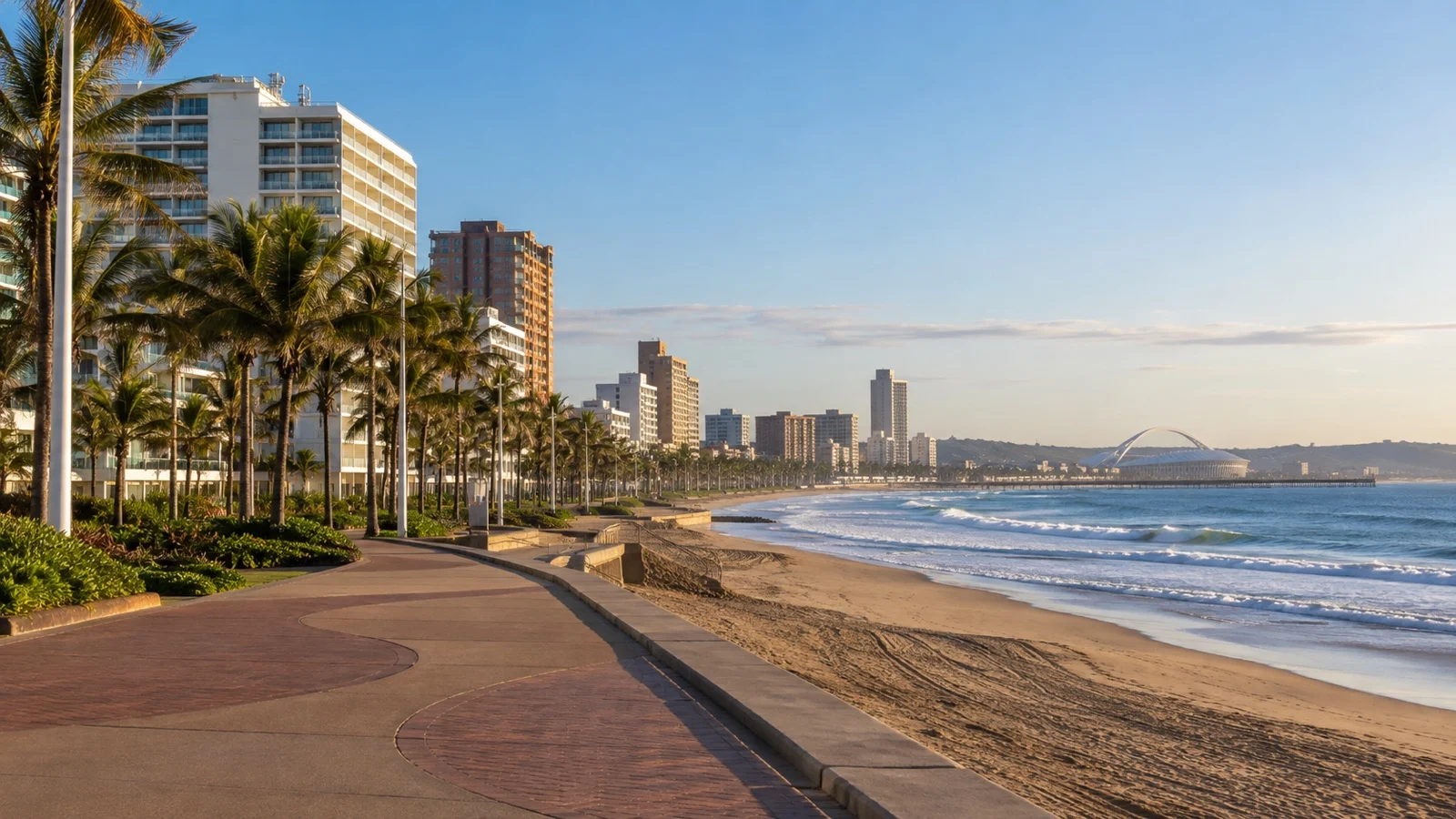 South Beach in Durban with practical hotel buildings, palm-lined promenade and Indian Ocean