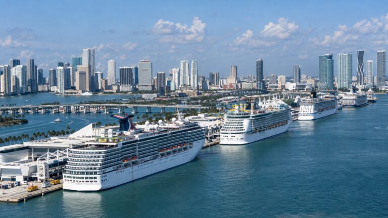 Cruise ships at PortMiami with the city skyline across Biscayne Bay