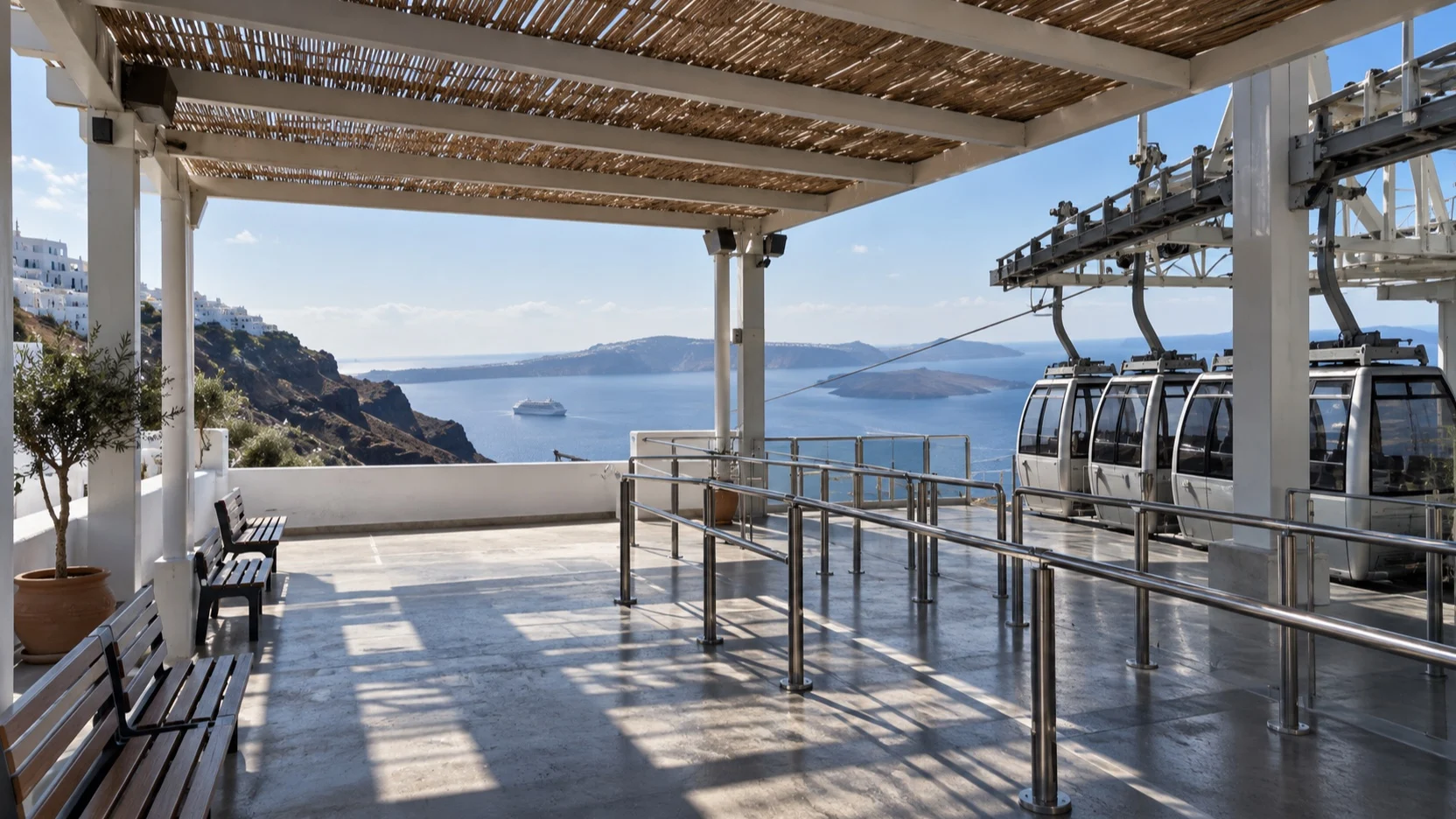 Shaded Santorini cable car station terrace above the caldera