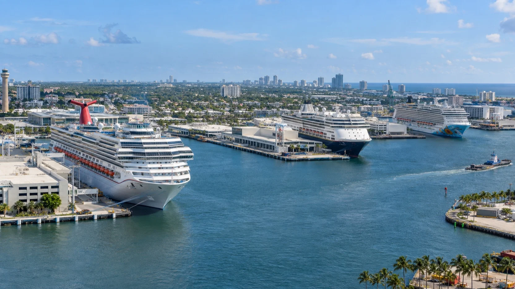 Cruise ships at Port Everglades terminals beside the Fort Lauderdale harbor channel