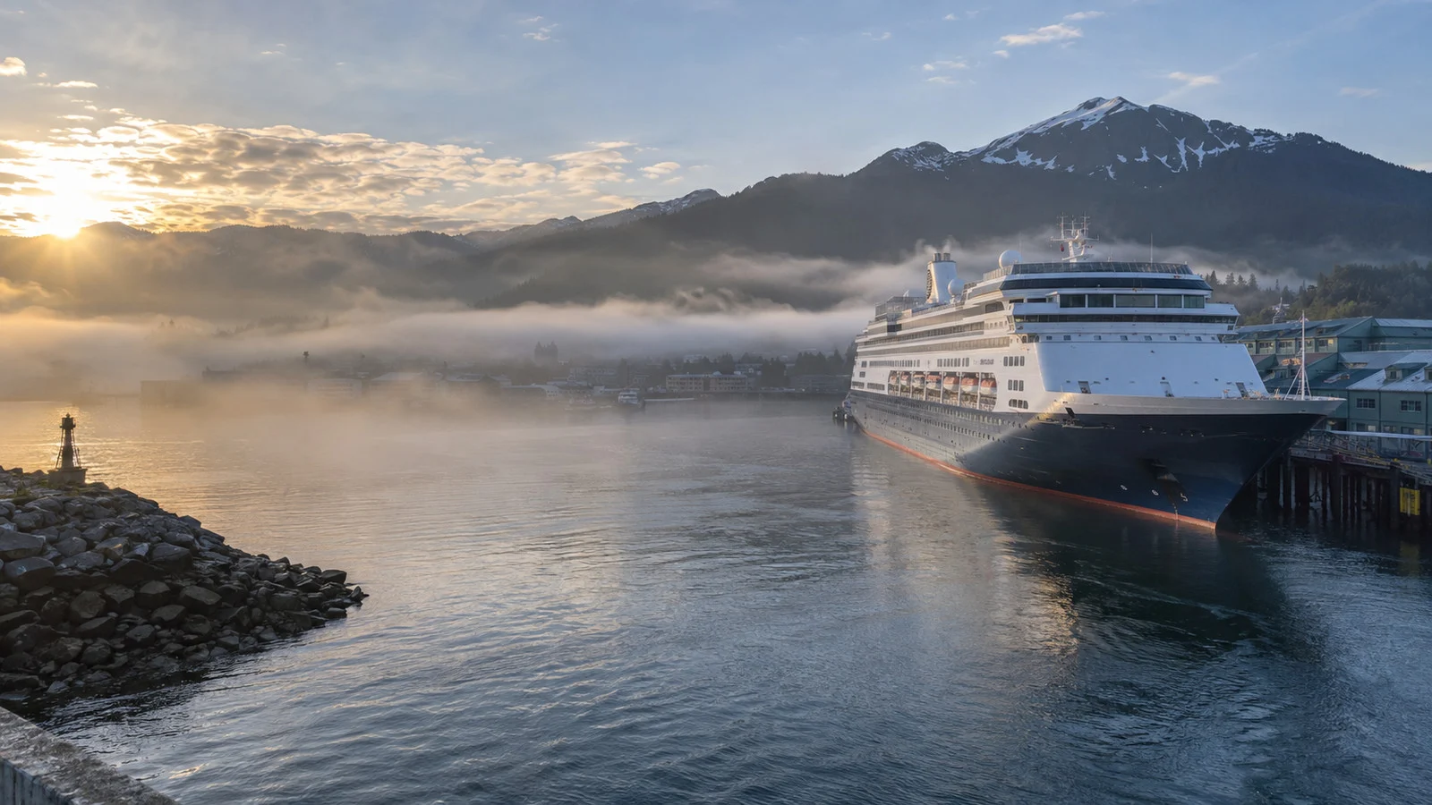 Cruise harbor clearing after morning fog with a ship at berth