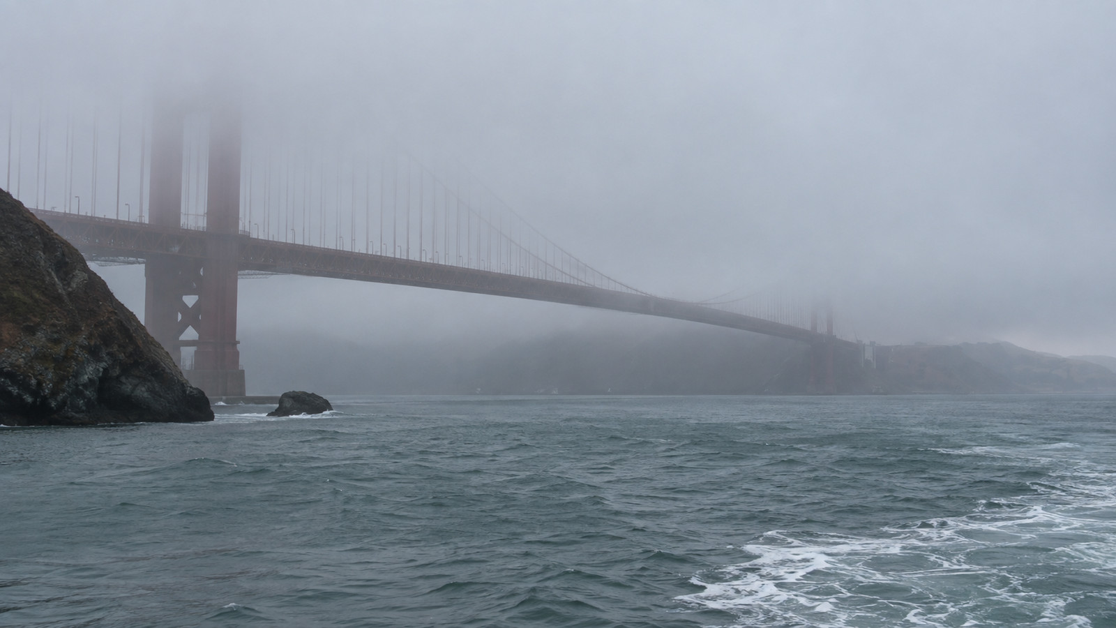 San Francisco Golden Gate Bridge barely visible in coastal fog