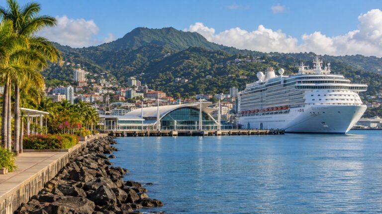 Pointe Simon cruise terminal in Fort-de-France with a white cruise ship beside the Martinique waterfront and green hills