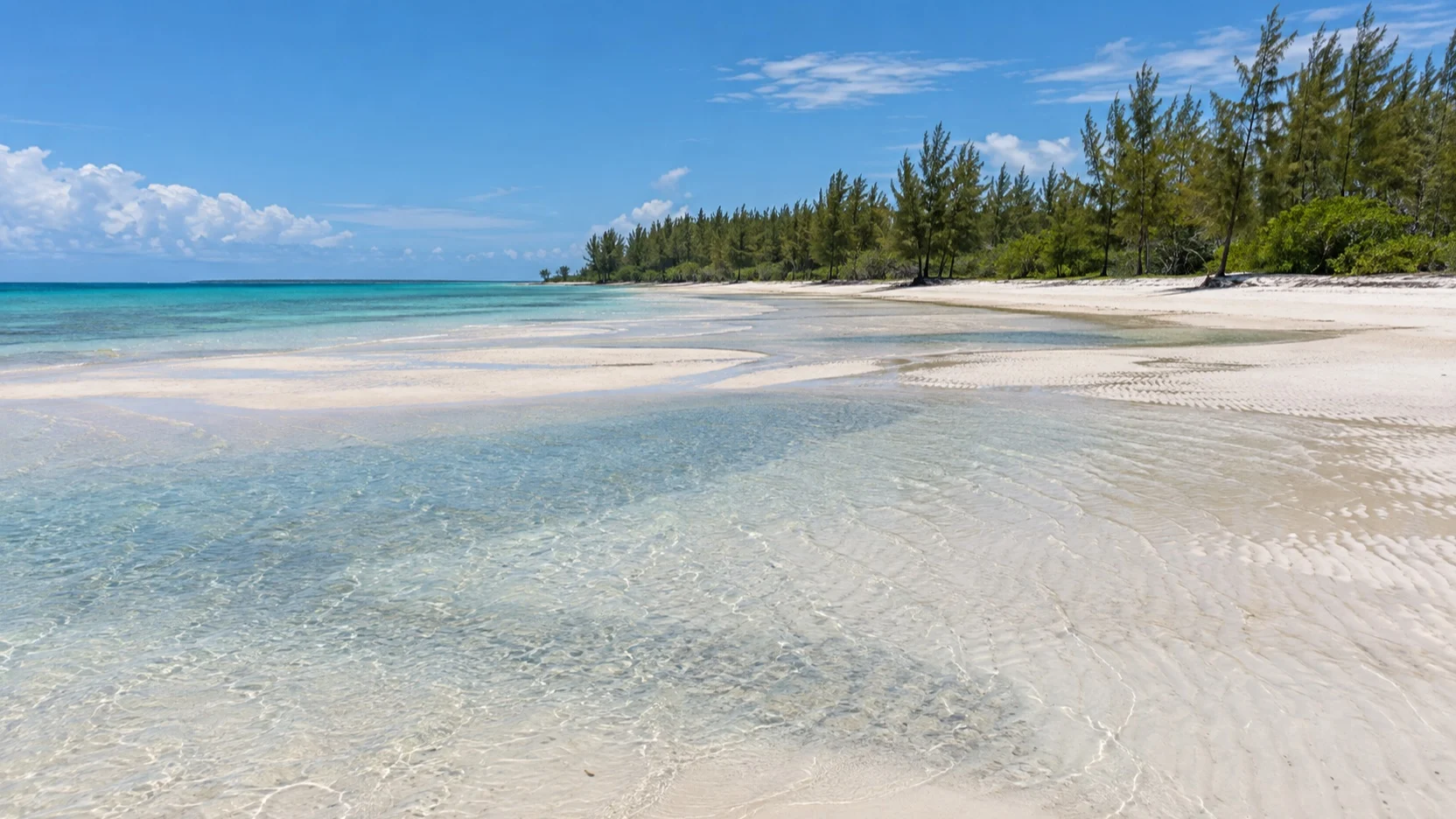 Wide sand flats at Gold Rock Beach on Grand Bahama at low tide