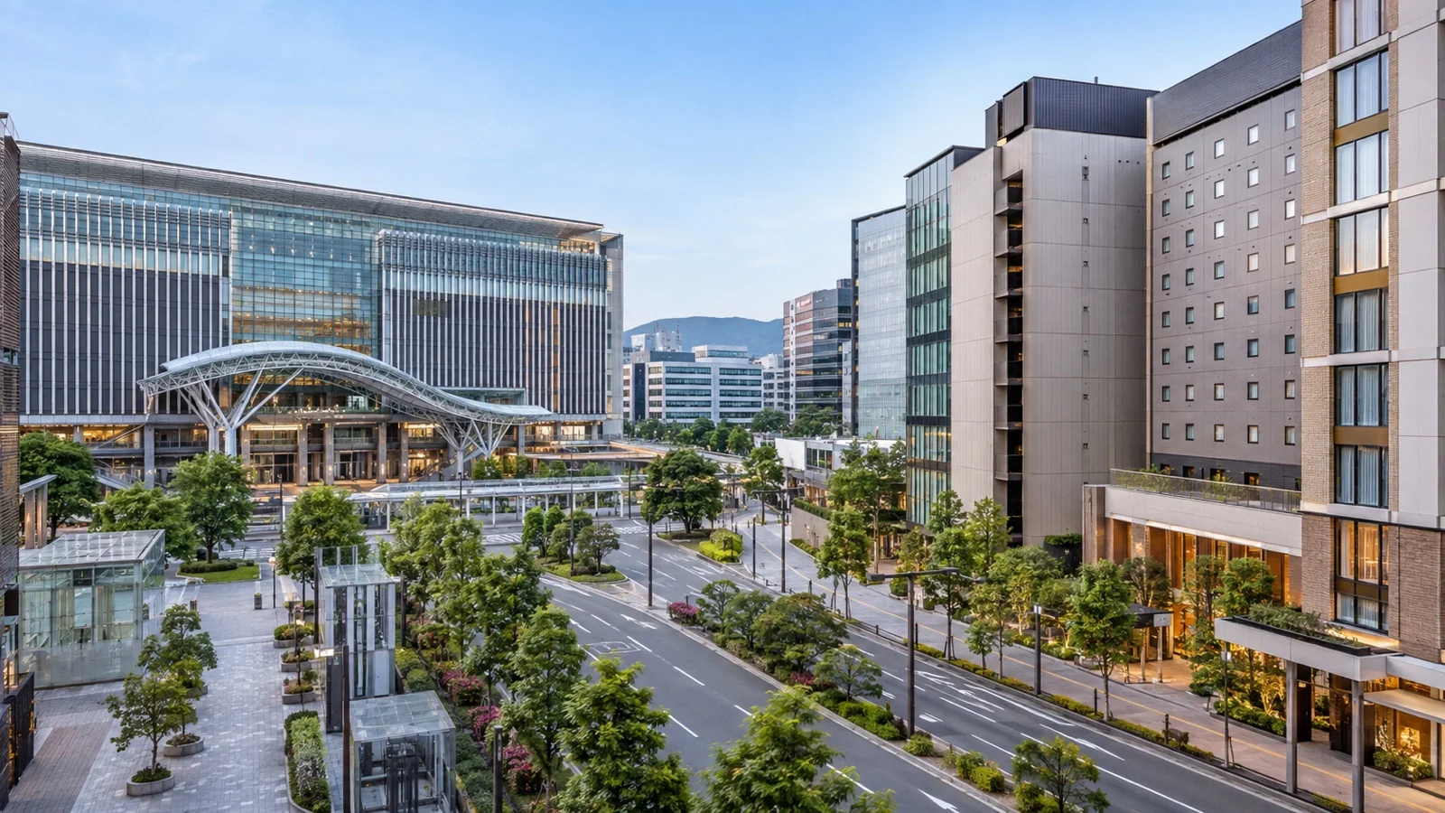 Hakata Station district in Fukuoka with contemporary midrise hotels, clean streets and recognizably Japanese urban architecture